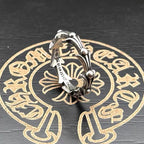 Silver-tone chrome cuff ring with open center and domed end beads