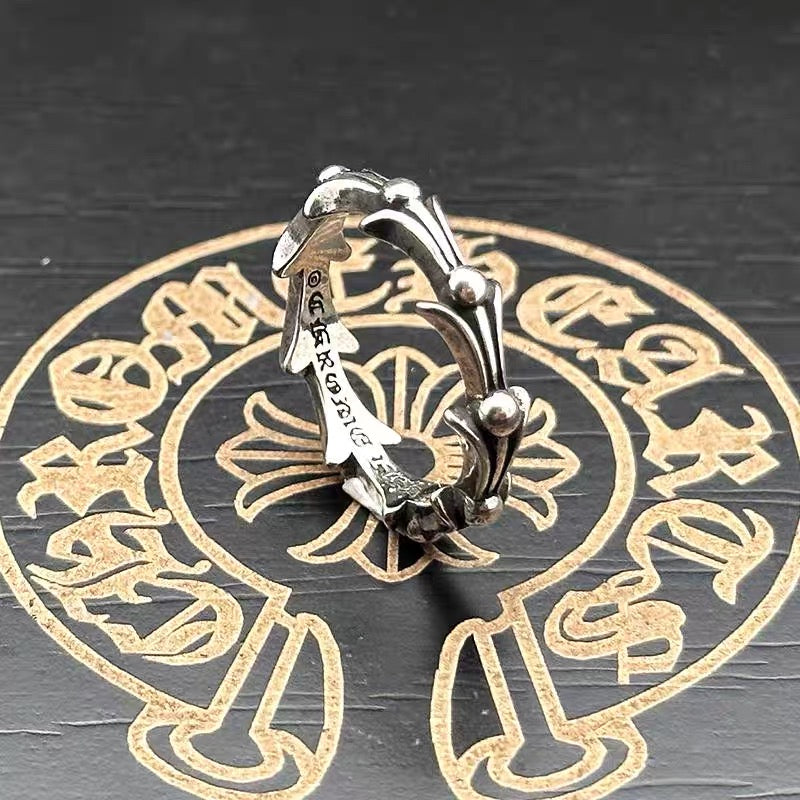 Silver-tone chrome cuff ring with open center and domed end beads
