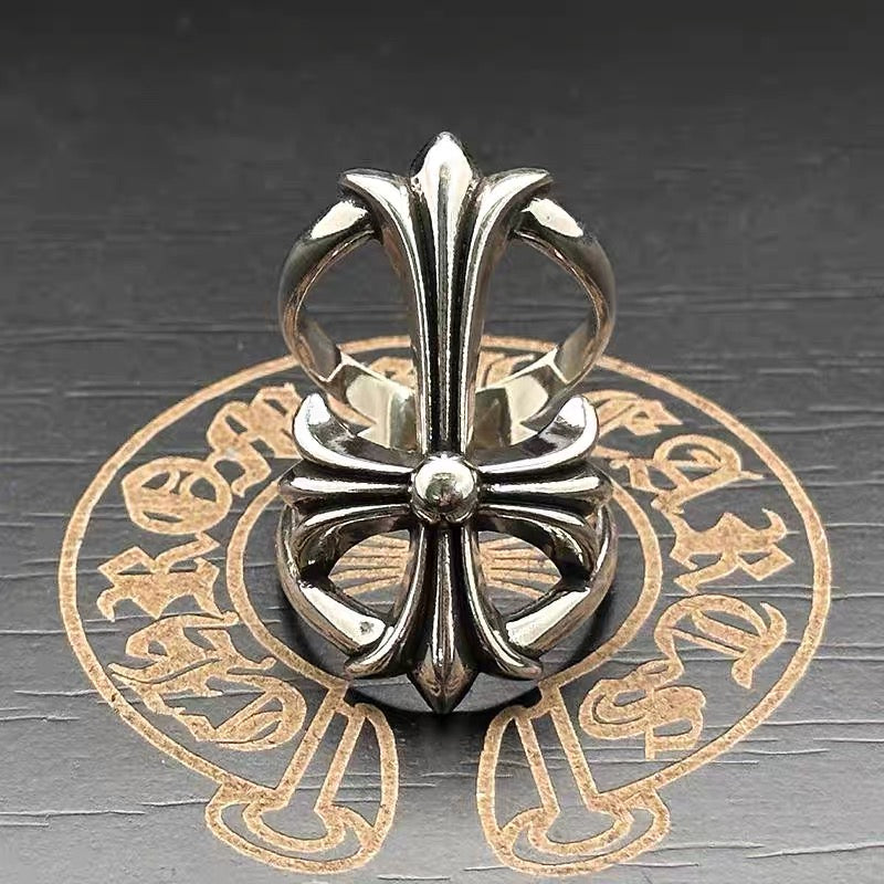 Chrome flower-shaped accessory with pointed petals and round center bead