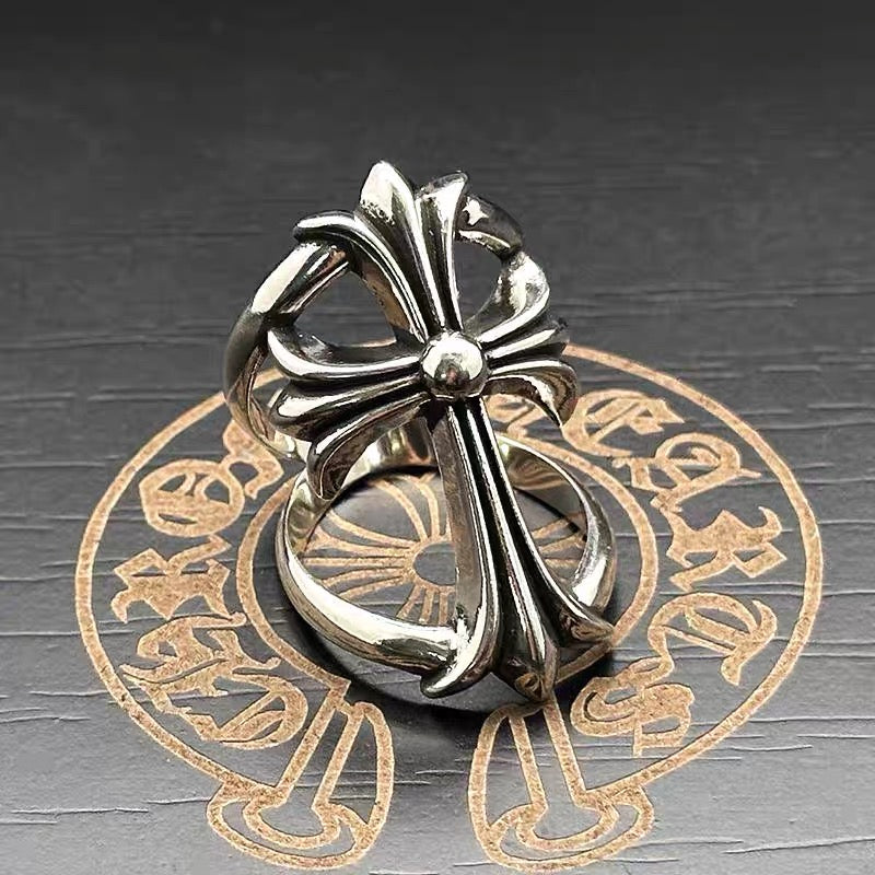 Chrome flower-shaped accessory viewed from the side, with central bead