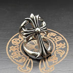 Chrome flower-shaped accessory viewed from the side, with central bead