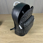 Coah backpack side view with zipper opening, patterned front panel, and black trim