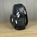 Coah backpack with side zip pocket, adjustable shoulder straps, and black trim