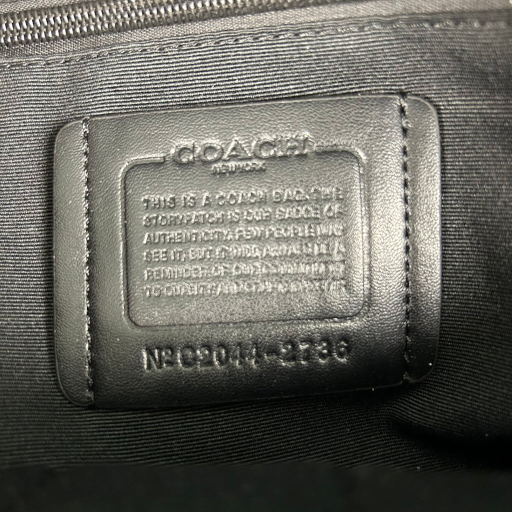Coah backpack leather brand patch with authentication text and serial number