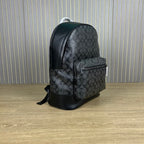 Coah monogram-style backpack with back panel, top handle, and black base