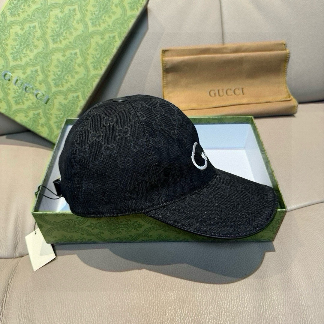 Black GG monogram baseball cap with white swoosh logo on side panel.