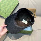 Black GG monogram baseball cap interior with lining and hanging labels.