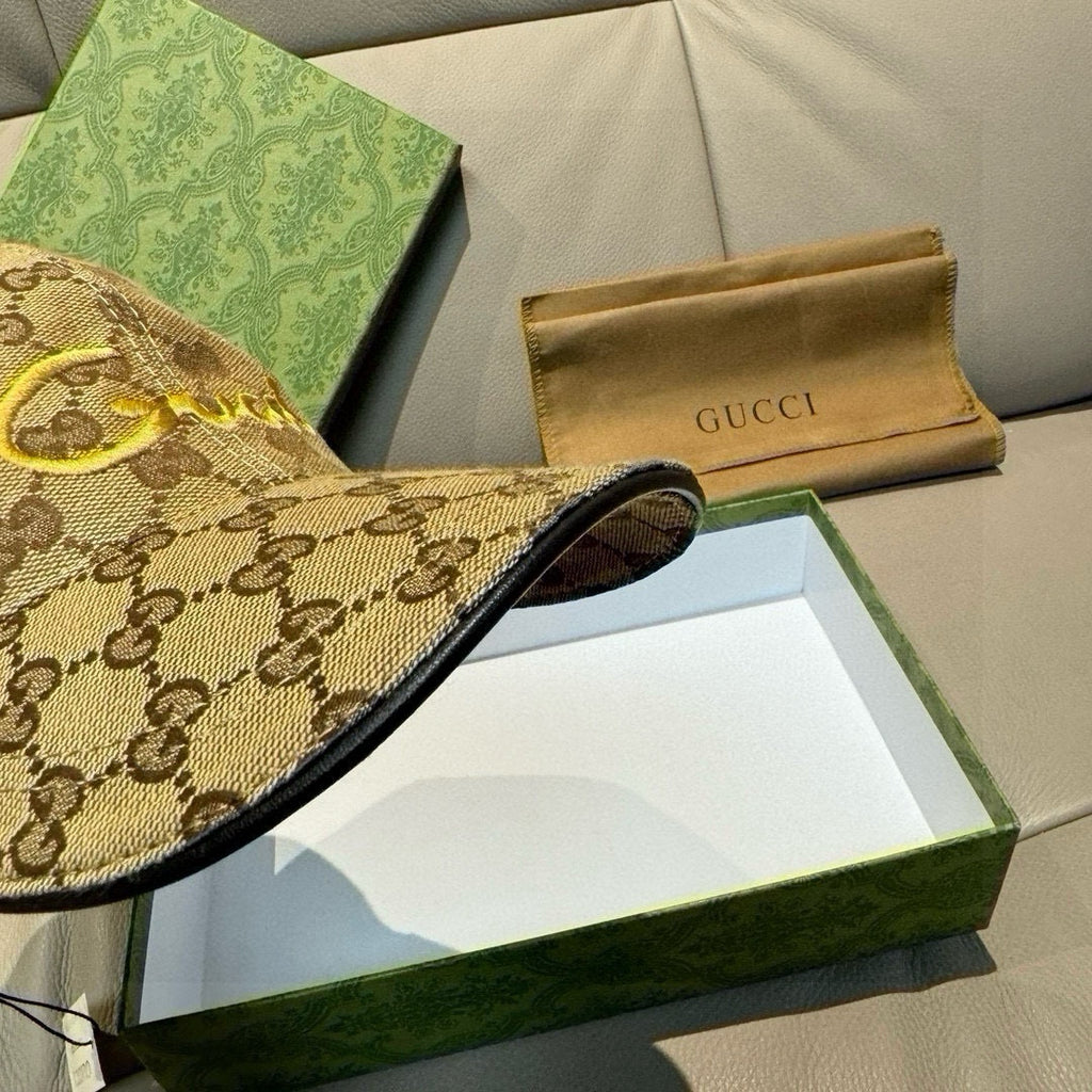 Gucci monogram cap visor close-up with dark fabric edge trim