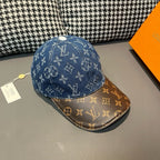 Blue monogram baseball cap with brown brim and gold-trim stitching