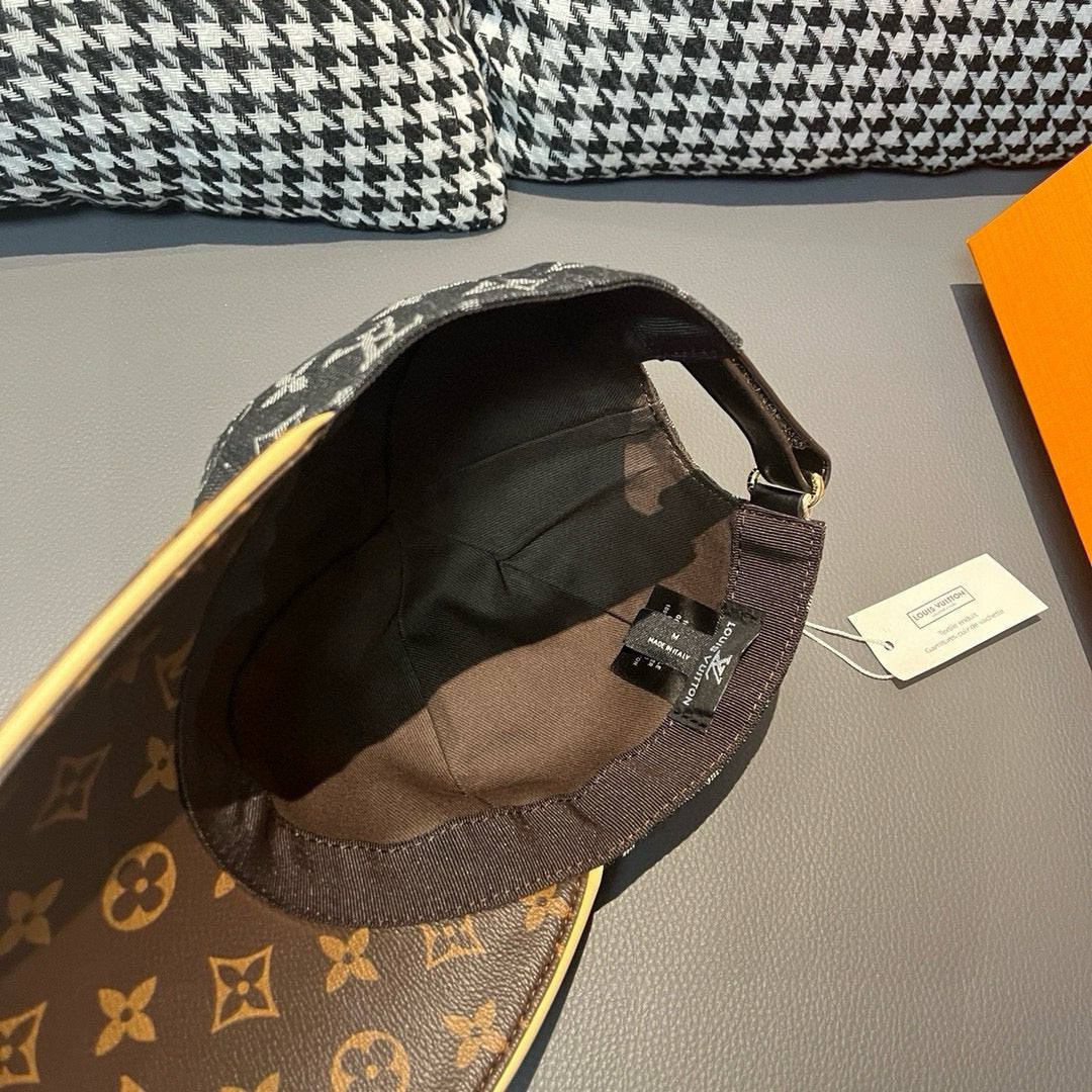 Louis Vuitton monogram cap with dark underside and brown brim, interior view
