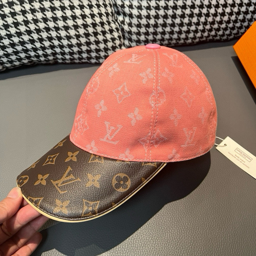 Louis Vuitton baseball cap close-up, pink crown with dark brown logo brim