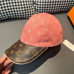 Louis Vuitton baseball cap close-up, pink crown with dark brown logo brim