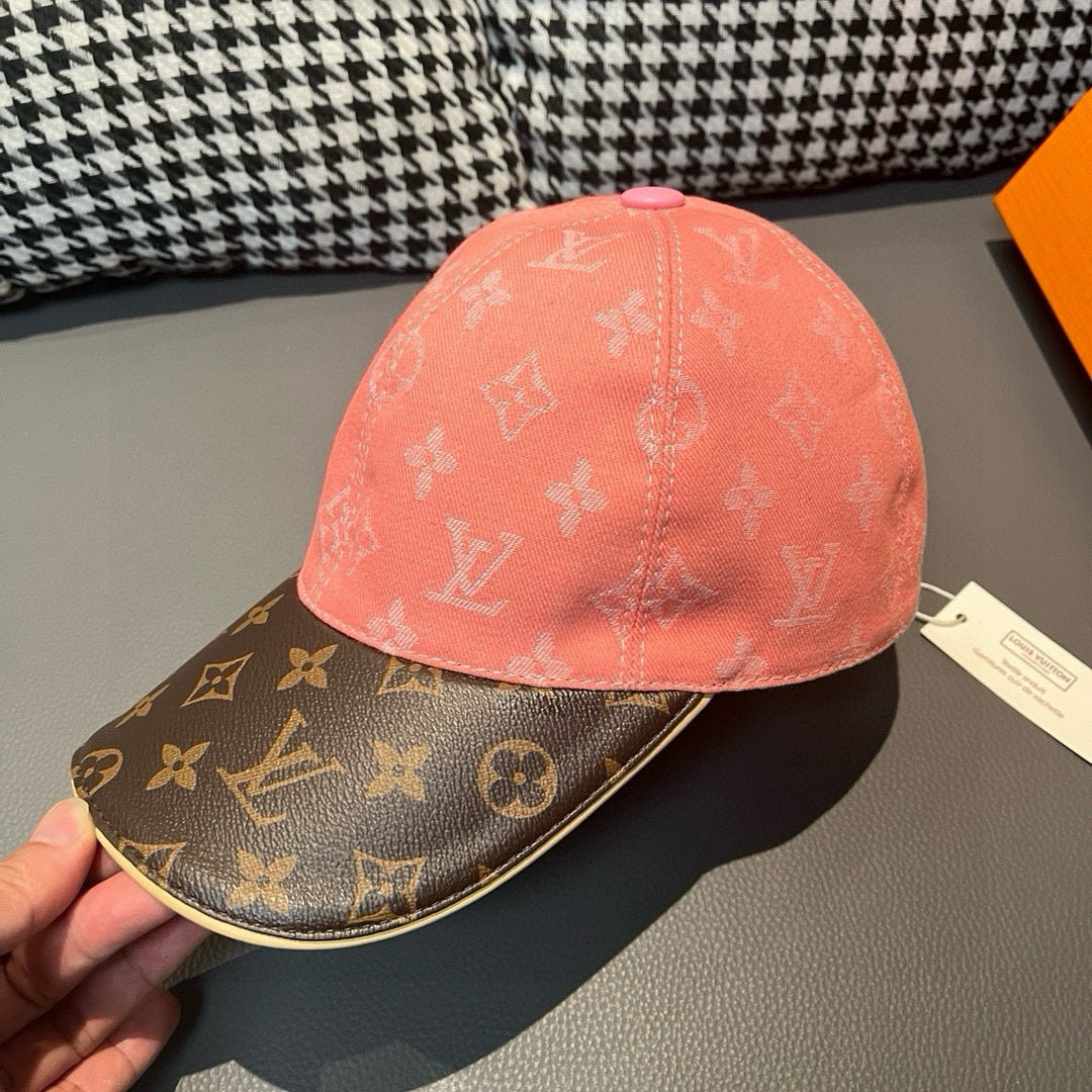 Louis Vuitton baseball cap close-up, pink crown with dark brown logo brim