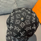 Louis Vuitton monogram baseball cap, black crown with textured pattern and top button