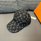 Louis Vuitton monogram baseball cap, black with repeating logo pattern, angled view