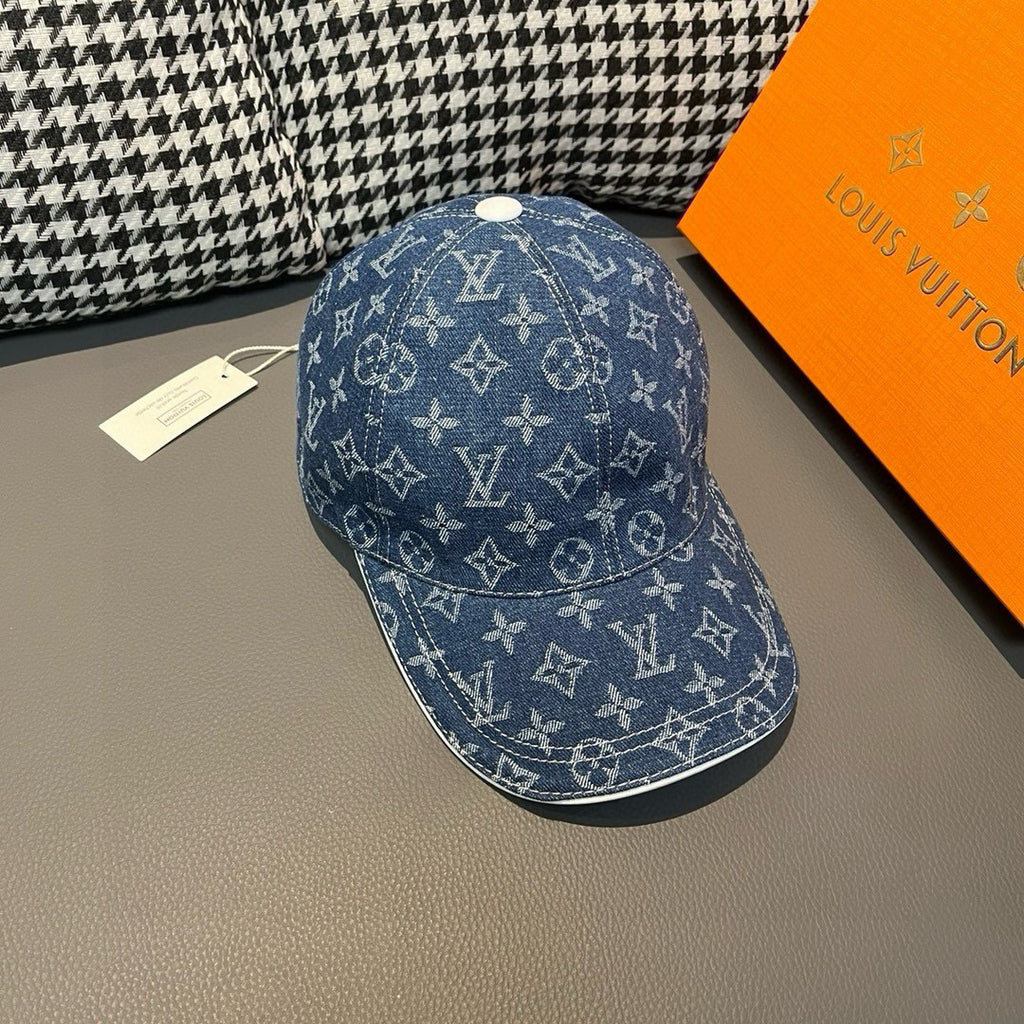 Louis Vuitton denim monogram cap, blue with white repeat logo pattern and curved brim.