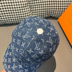 Louis Vuitton denim monogram cap, blue with white repeat symbols, round top button.