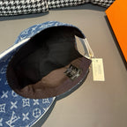 Louis Vuitton monogram denim cap interior with black lining and attached fabric tag.