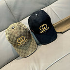 Pair of caps: tan GG-print cap and black Gucci logo cap with button top