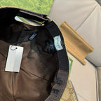 Black baseball cap interior with adjustable strap and Gucci label