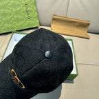 Black Gucci cap with GG monogram fabric and round top button detail