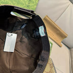 Black Gucci cap interior close-up with woven strap and small brand label