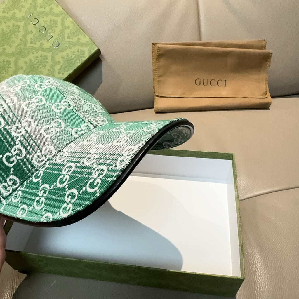 Green GG monogram baseball cap side profile with curved brim and top button.