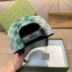 Green GG monogram cap showing inner band with Gucci logo and hanging tag.