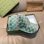 Green GG monogram baseball cap with curved brim and visible stitched panel seams.