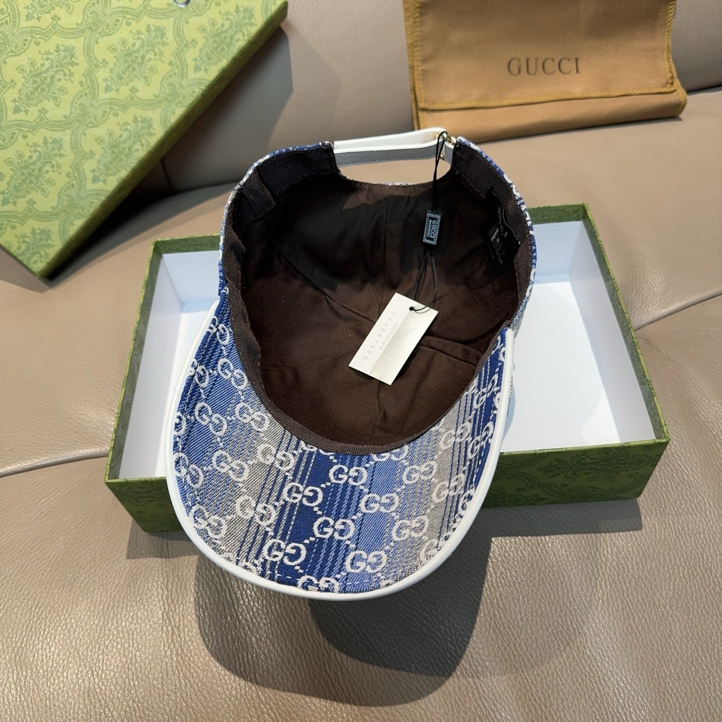 Gucci blue GG monogram cap interior with brown lining and hanging tag