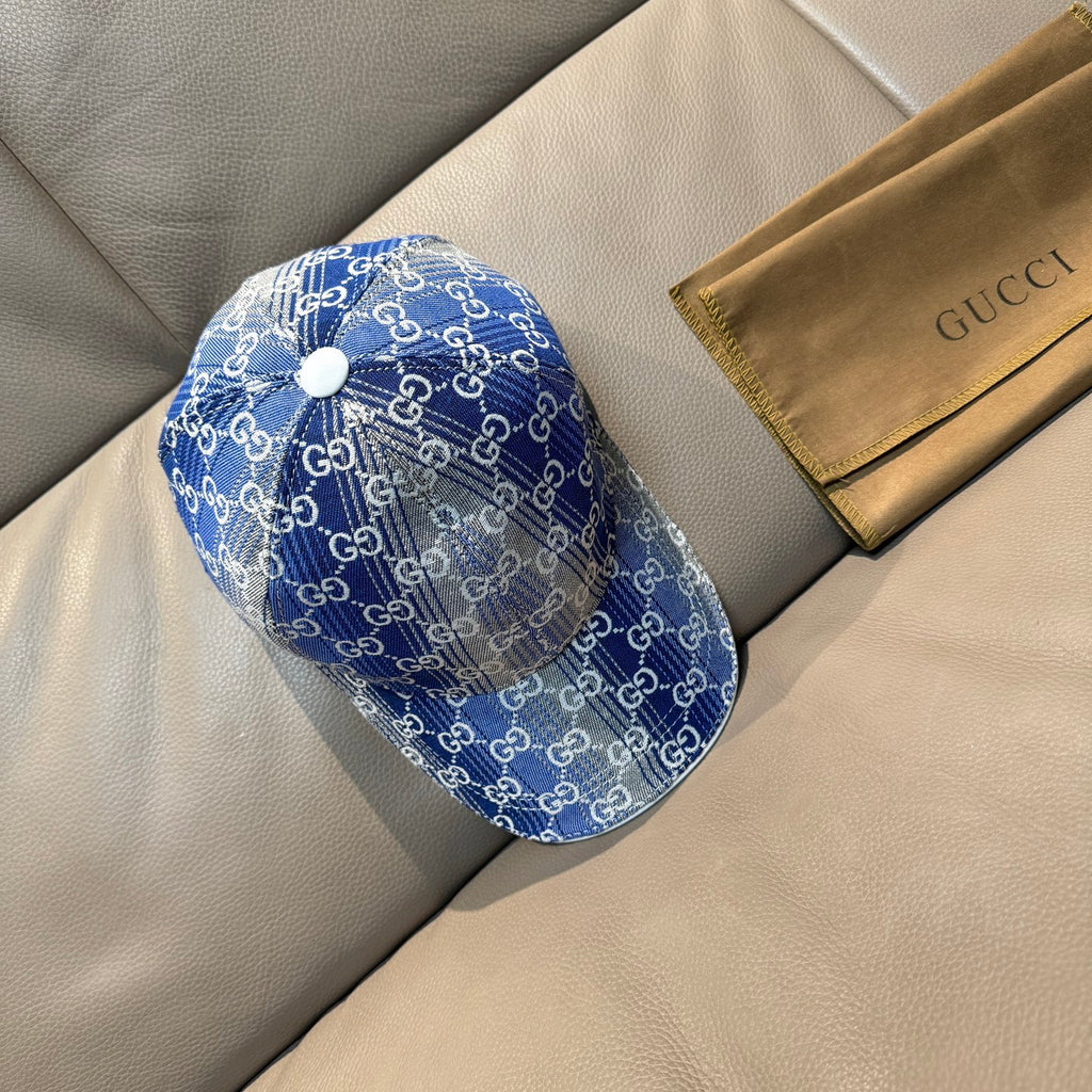 Gucci blue GG monogram baseball cap with white top button and curved brim