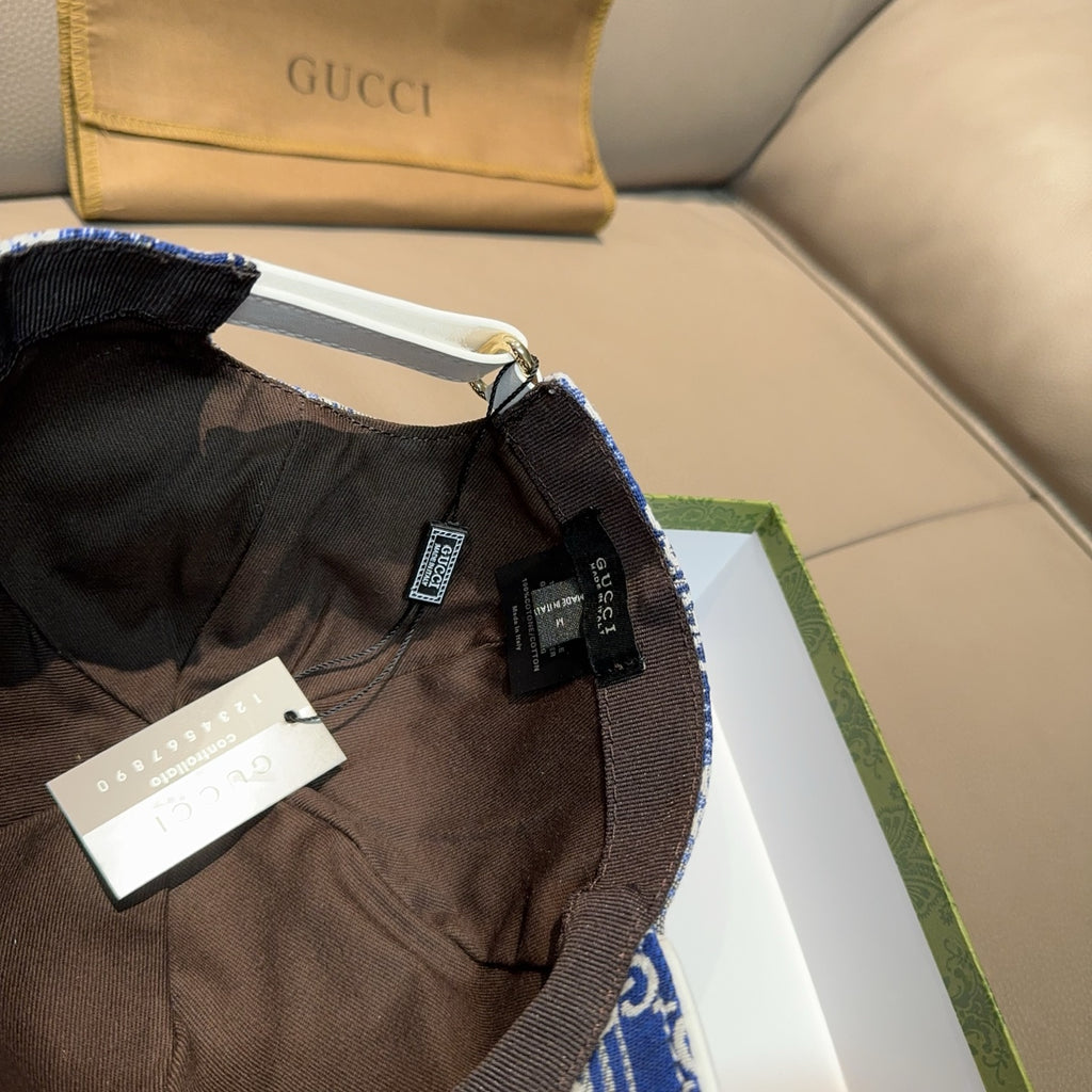 Gucci blue GG monogram cap interior with black strap and product tags