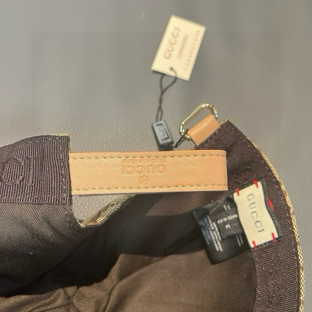 Cap interior view showing tan label, strap, and small hanging tag