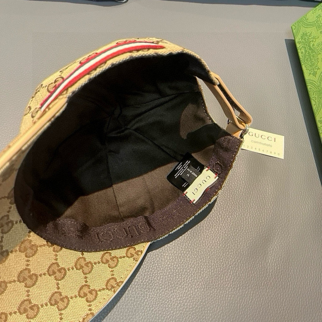 Baseball cap interior with black lining and adjustable strap with tags