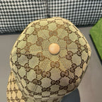 Tan GG baseball cap back panel with small circular button detail