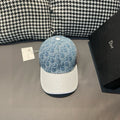 Dior cap with blue denim-style logo print and white textured brim, round button top