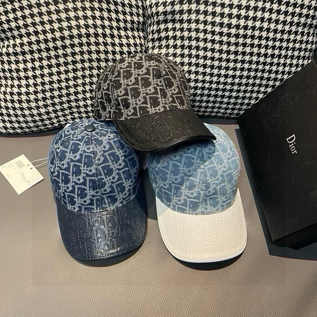 Dior caps set of two: blue monogram cap and dark monogram cap.