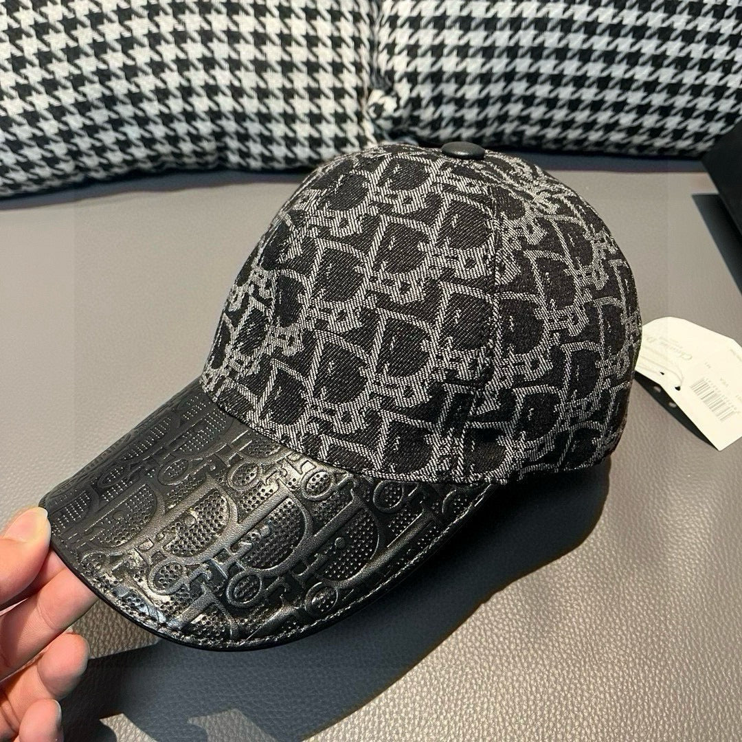 Dior baseball cap front view with black and gray monogram fabric.