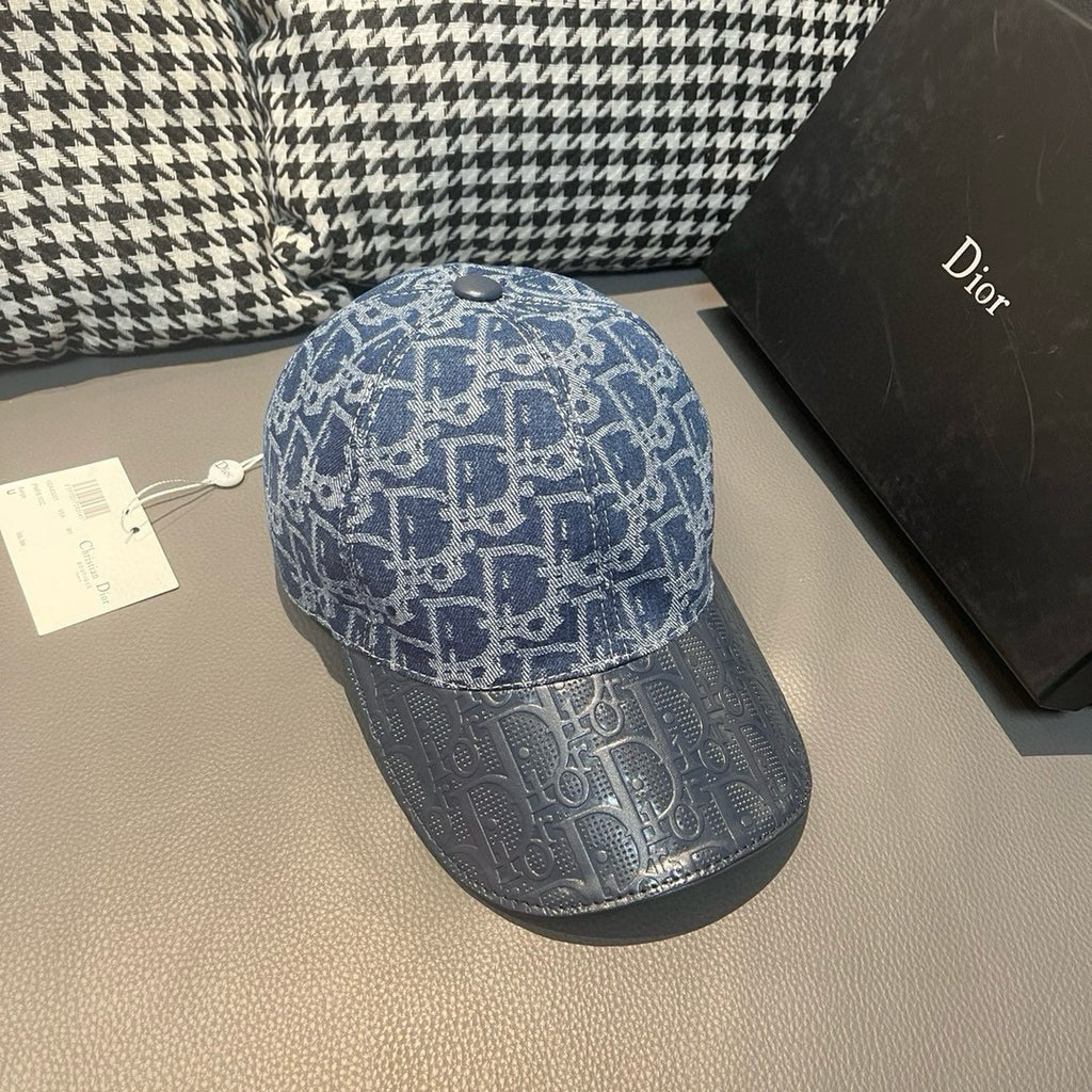 Blue patterned baseball cap with short brim and metal button on top; side view.