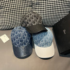 Two caps: blue monogram baseball cap and dark cap with matching monogram pattern brim.