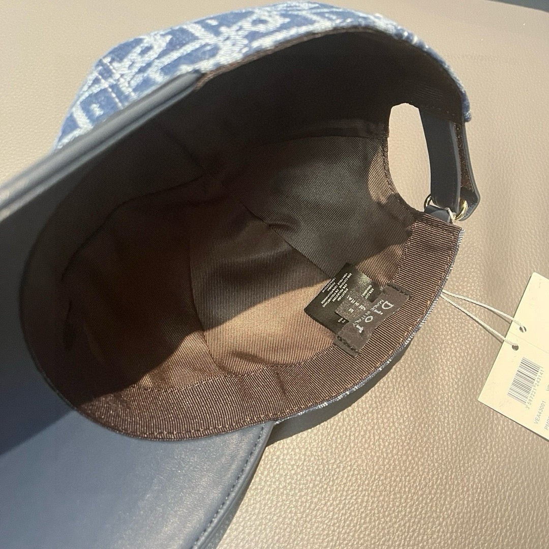Inside view of blue baseball cap showing dark interior lining and adjustable strap.