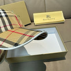 Plaid cap brim close-up with underside trim; beige, black, white, red