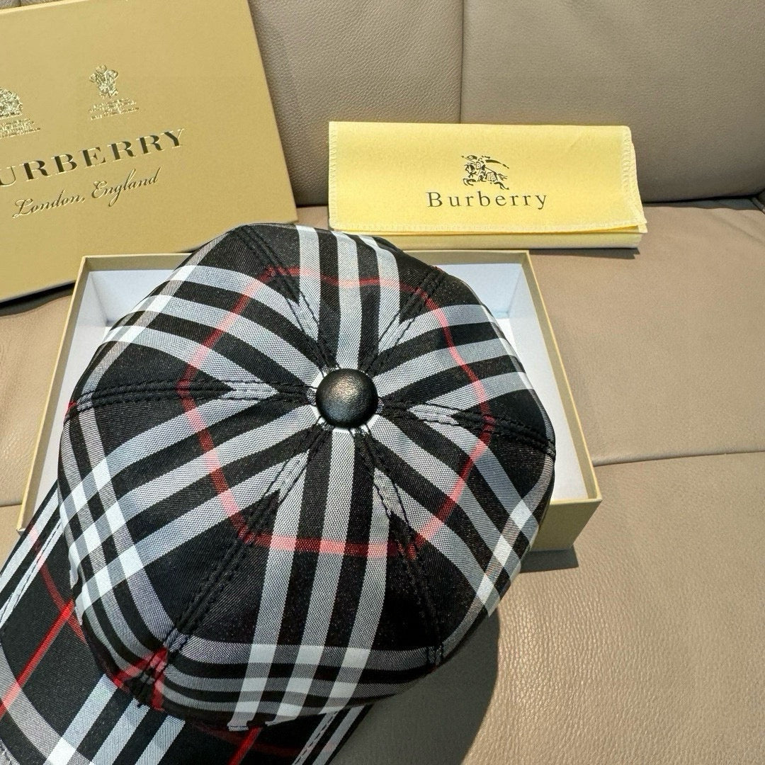 Plaid baseball cap with black, white, and red check pattern; circular top button