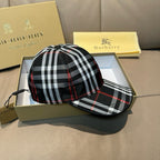 Plaid baseball cap with black, white, and red check pattern; curved brim and button top