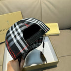Plaid baseball cap with black interior lining and black strap; black, white, red check panels