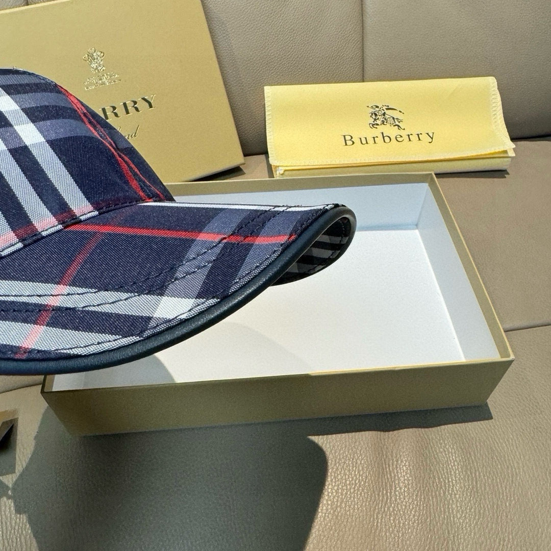 Close-up of navy plaid baseball cap brim with red and white lines