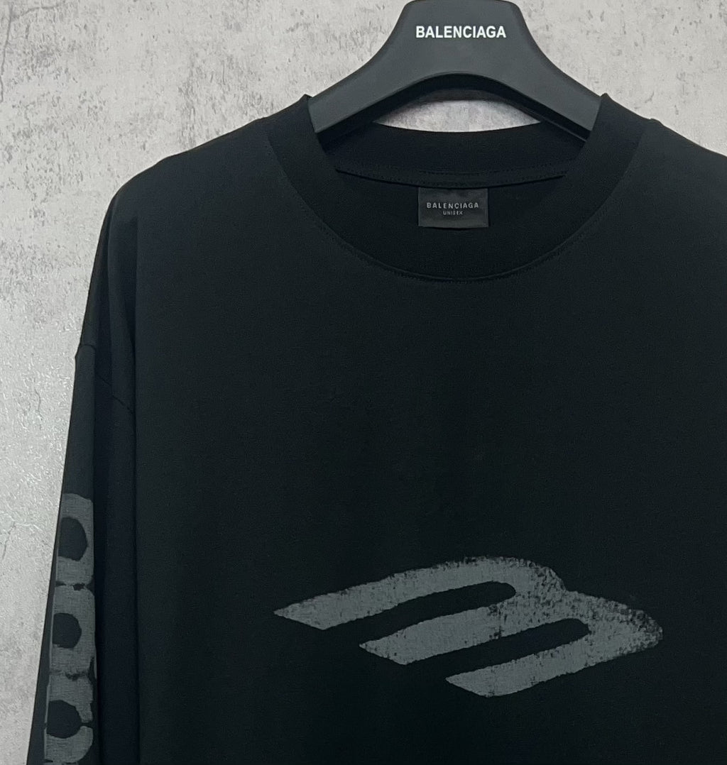 Balenciaga long-sleeve T-shirt, dark upper front close-up with “B” style logo