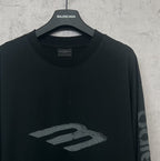 Balenciaga long-sleeve T-shirt, dark front view with large “B” style logo graphic