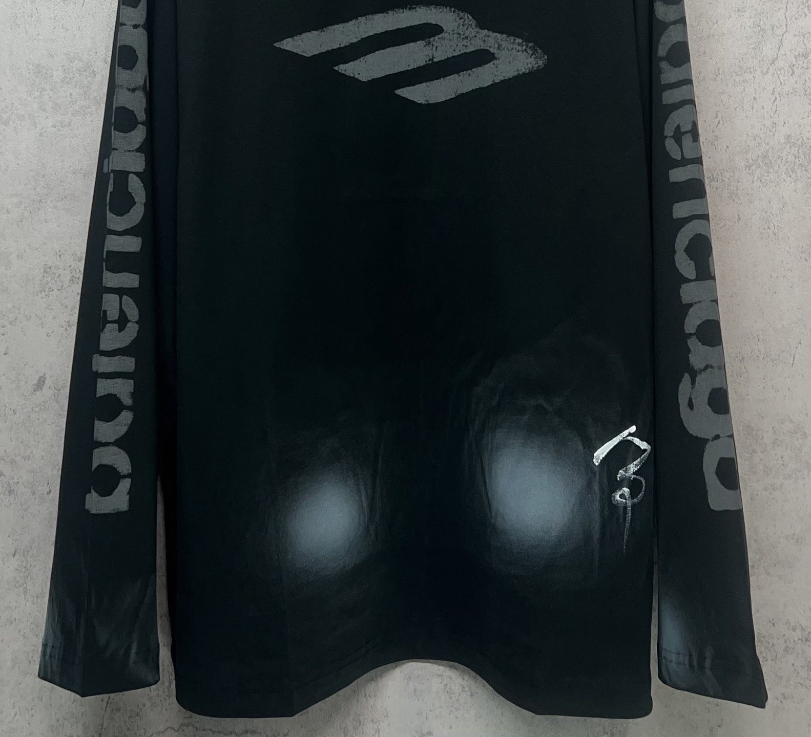Balenciaga long-sleeve T-shirt, dark front with “B” style logo and logo sleeve text