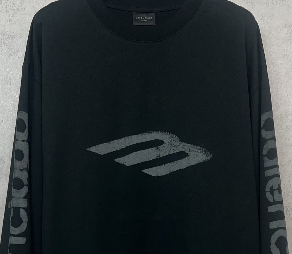 Balenciaga long-sleeve T-shirt, dark front close-up with large “B” style logo graphic